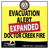 Image may contain: text that says 'EVACUATION ALERT EXPANDED DOCTOR CREEK FIRE Regional Districtof East Kootenay 1-888-478-7335 www.rdek.bc.ca'