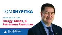 Image may contain: 1 person, suit, text that says 'TOM SHYPITKA YOUR CRITIC FOR Energy, Mines, Petroleum Resources BC LIBERAL CAUCUS க'